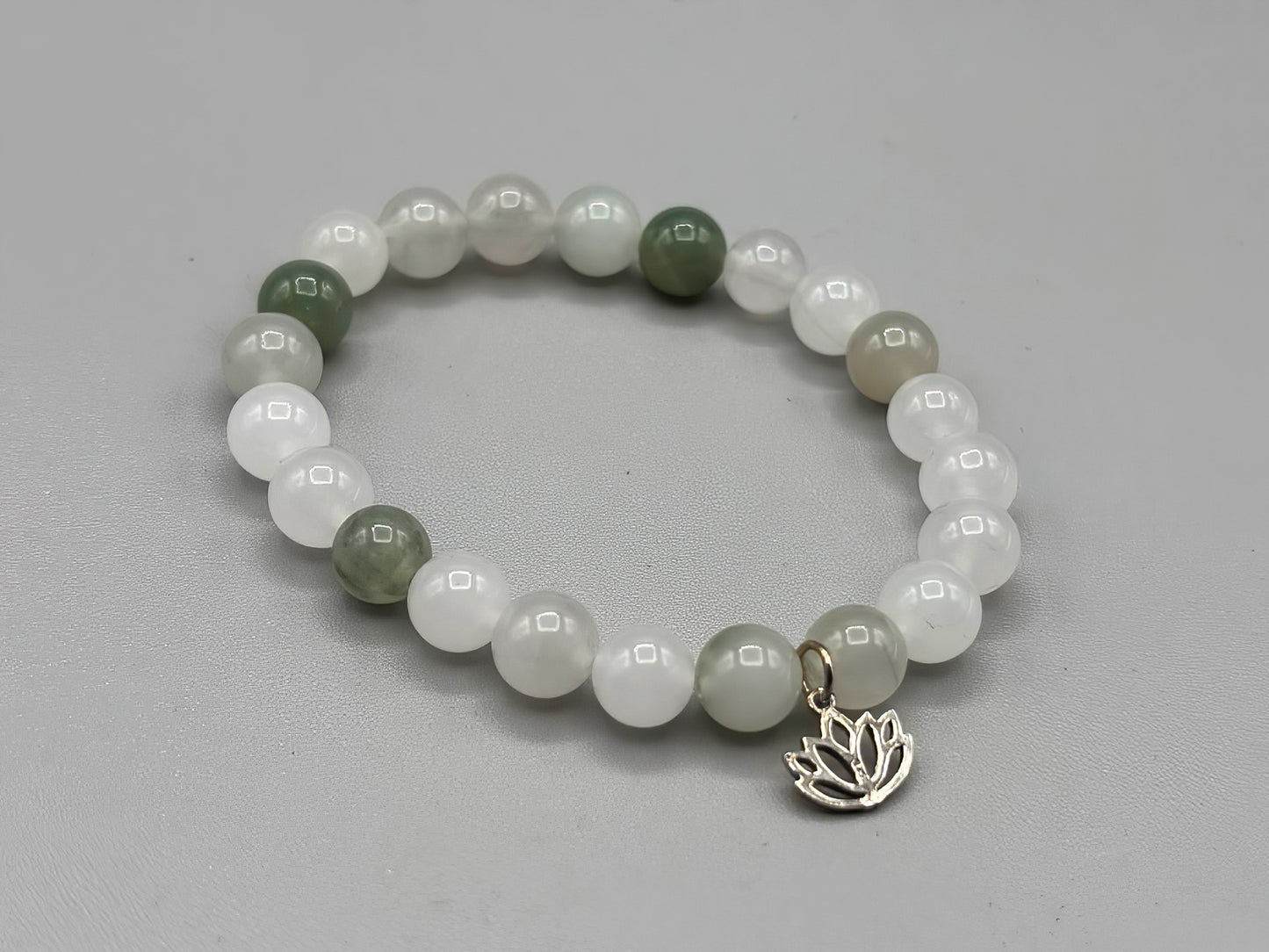 7 inch Jade beaded bracelet with sterling silver lotus charm