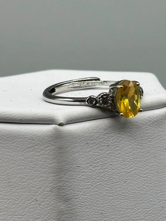 Yellow Cubic Zirconia with white accents, set in adjustable sterling silver band