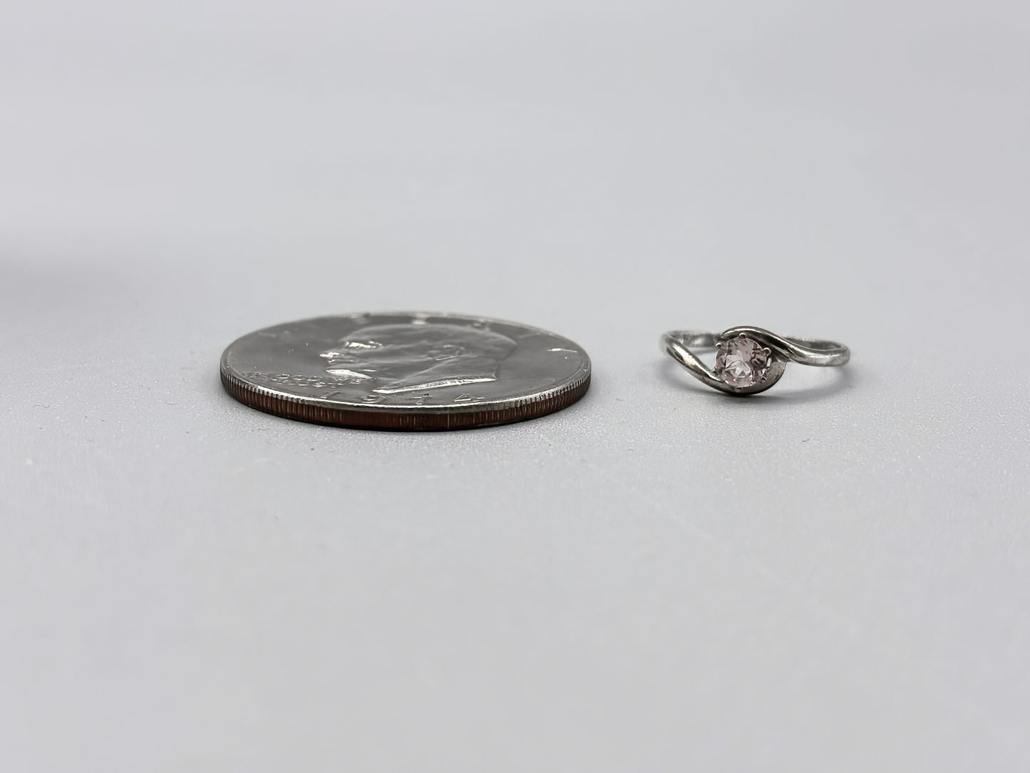 5mm Pink Morganite Facet set in a sterling silver bypass ring setting, Size 7