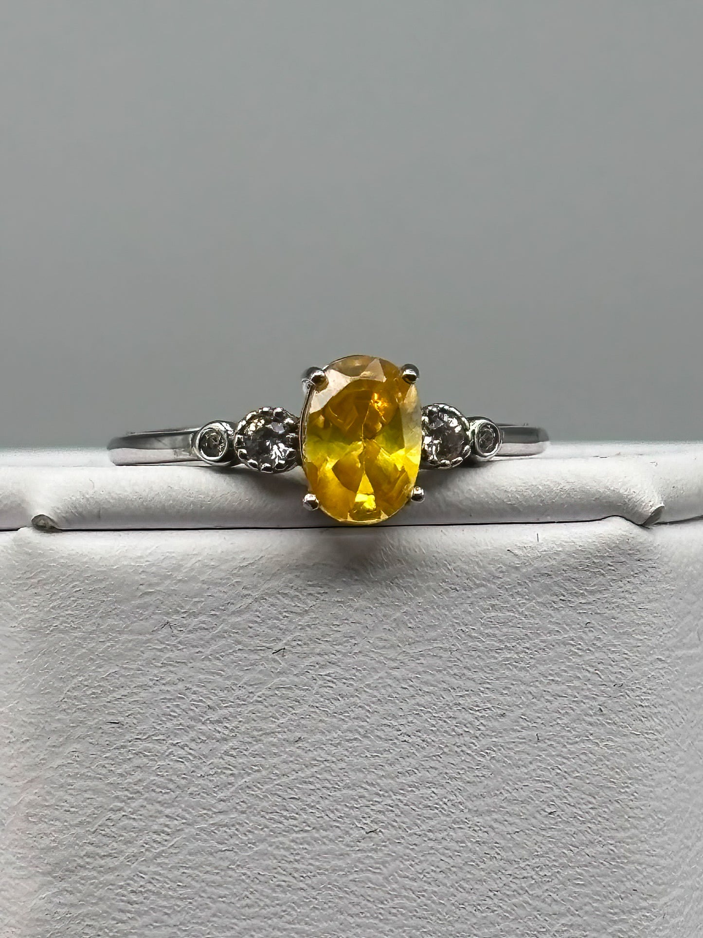 Yellow Cubic Zirconia with white accents, set in adjustable sterling silver band