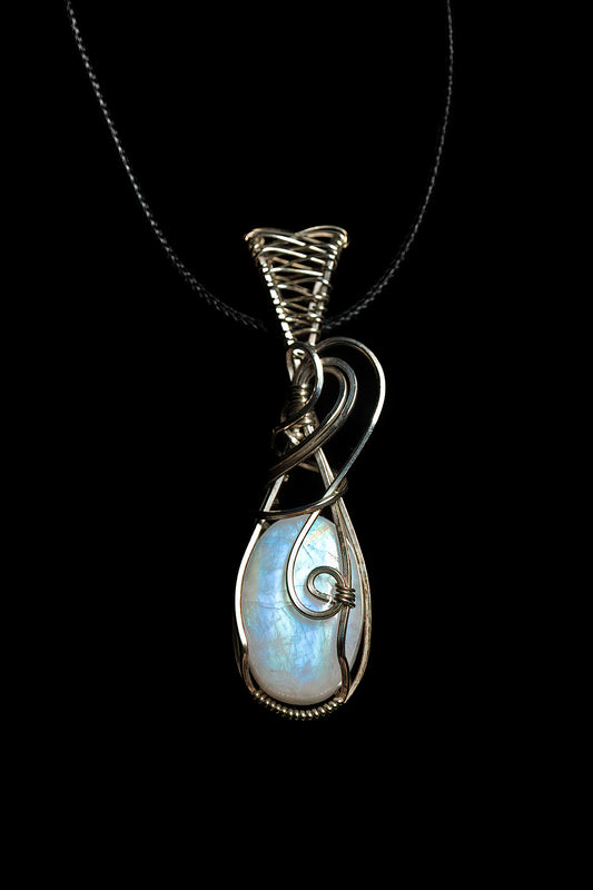 Thick, oval moonstone with fancy bale, wrapped in .925 sterling silver