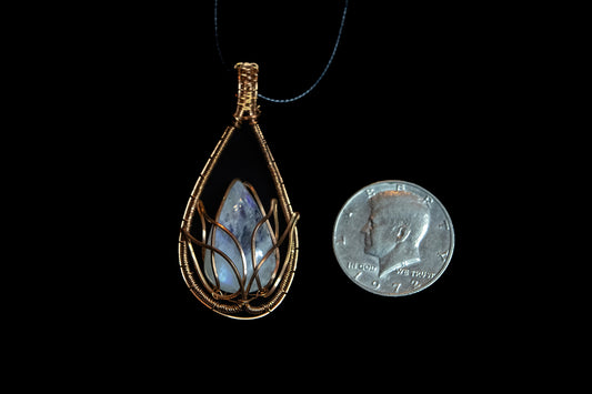 Translucent, blue flash Moonstone wrapped in Fine Copper Lotus Cage