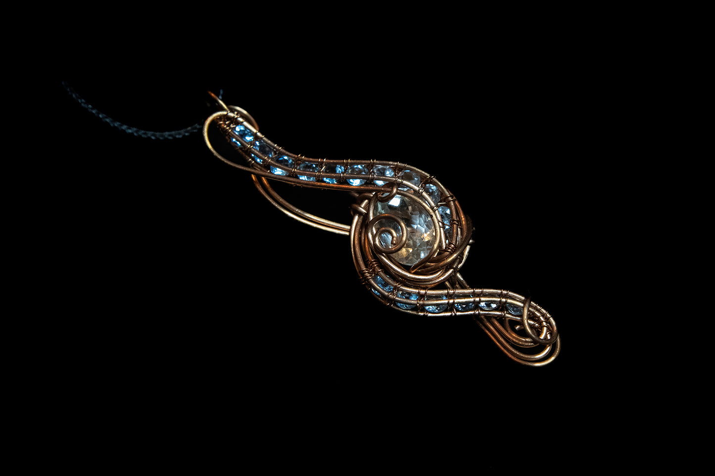 Blue and White Topaz wrapped in Fine Copper