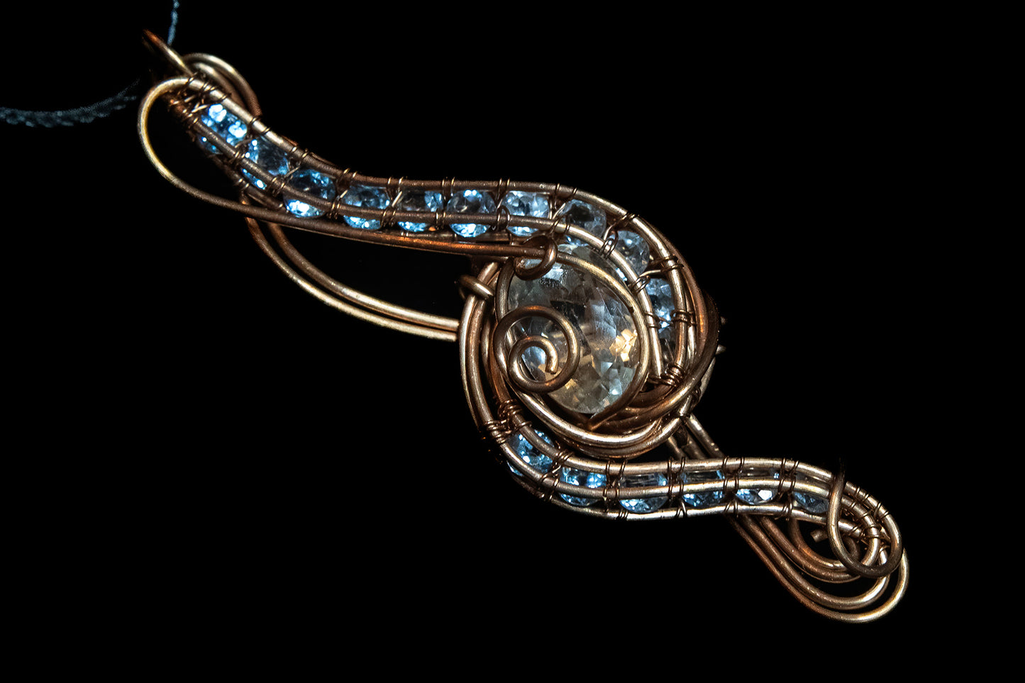 Blue and White Topaz wrapped in Fine Copper