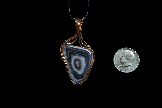 Pink and Purple Botswana Agate with White Topaz Accent wrapped in Fine Copper
