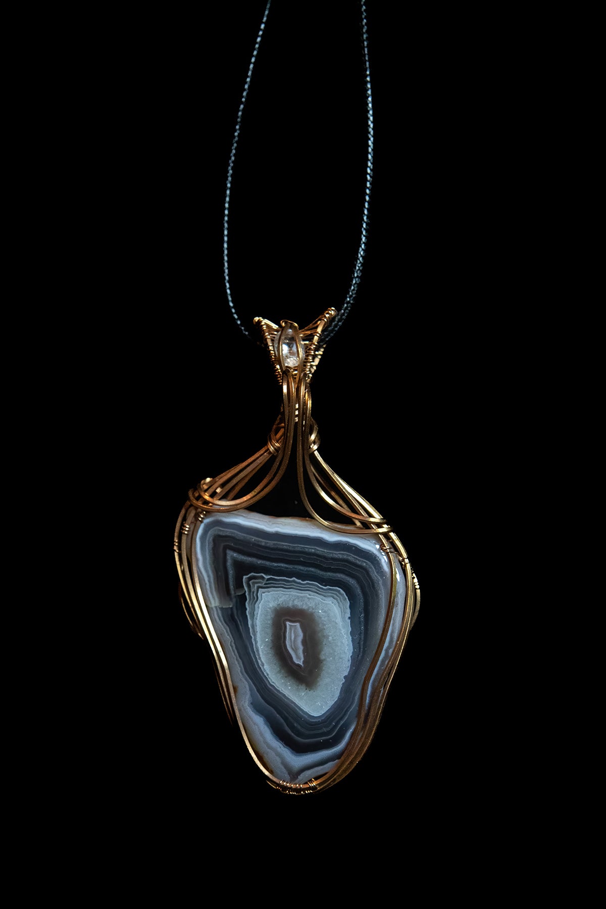 Pink and Purple Botswana Agate with White Topaz Accent wrapped in Fine Copper