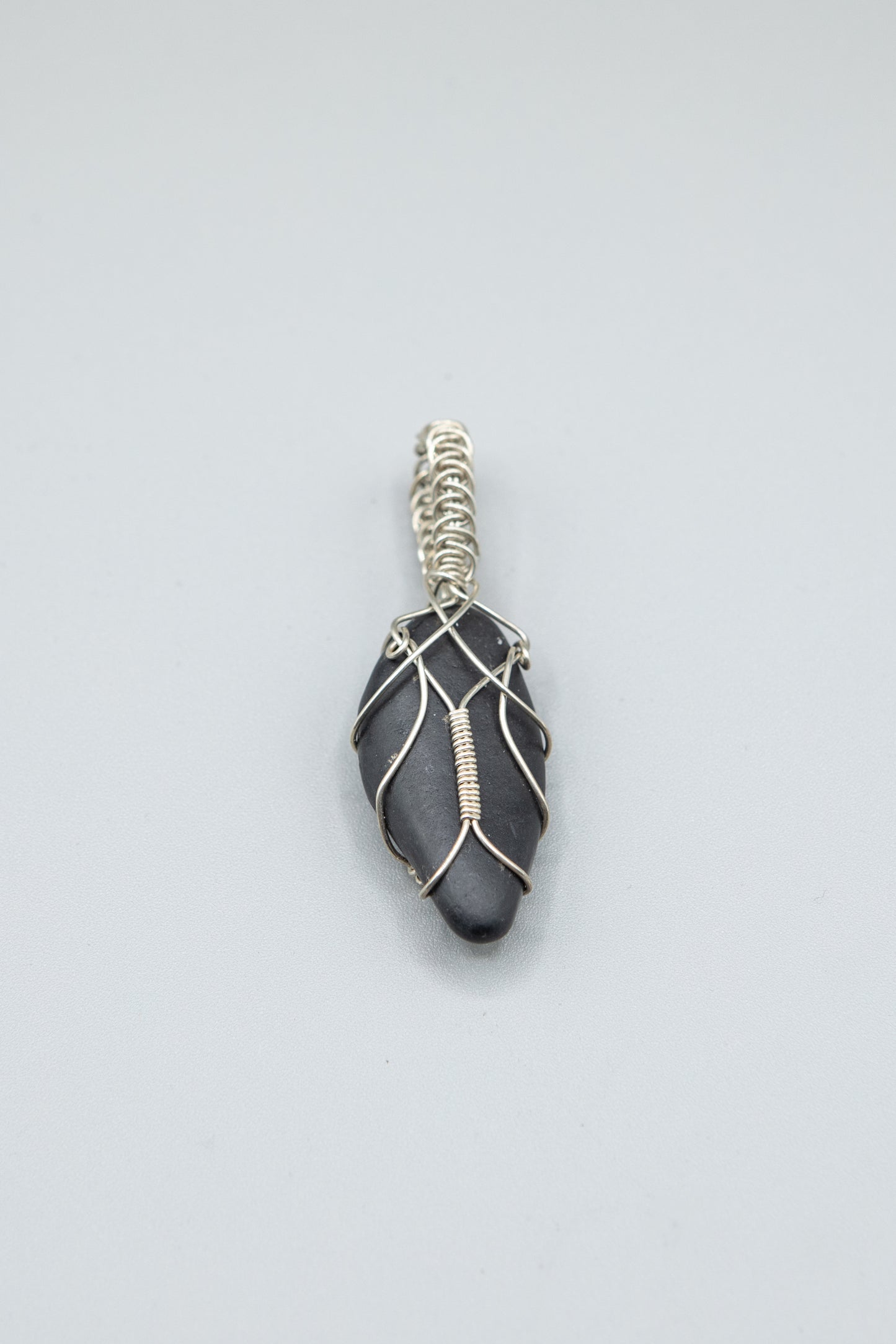 Lake Michigan Black Basalt wrapped in Sterling Silver