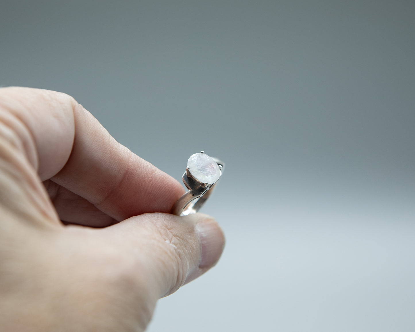 Moonstone with pale pink flash, sterling band