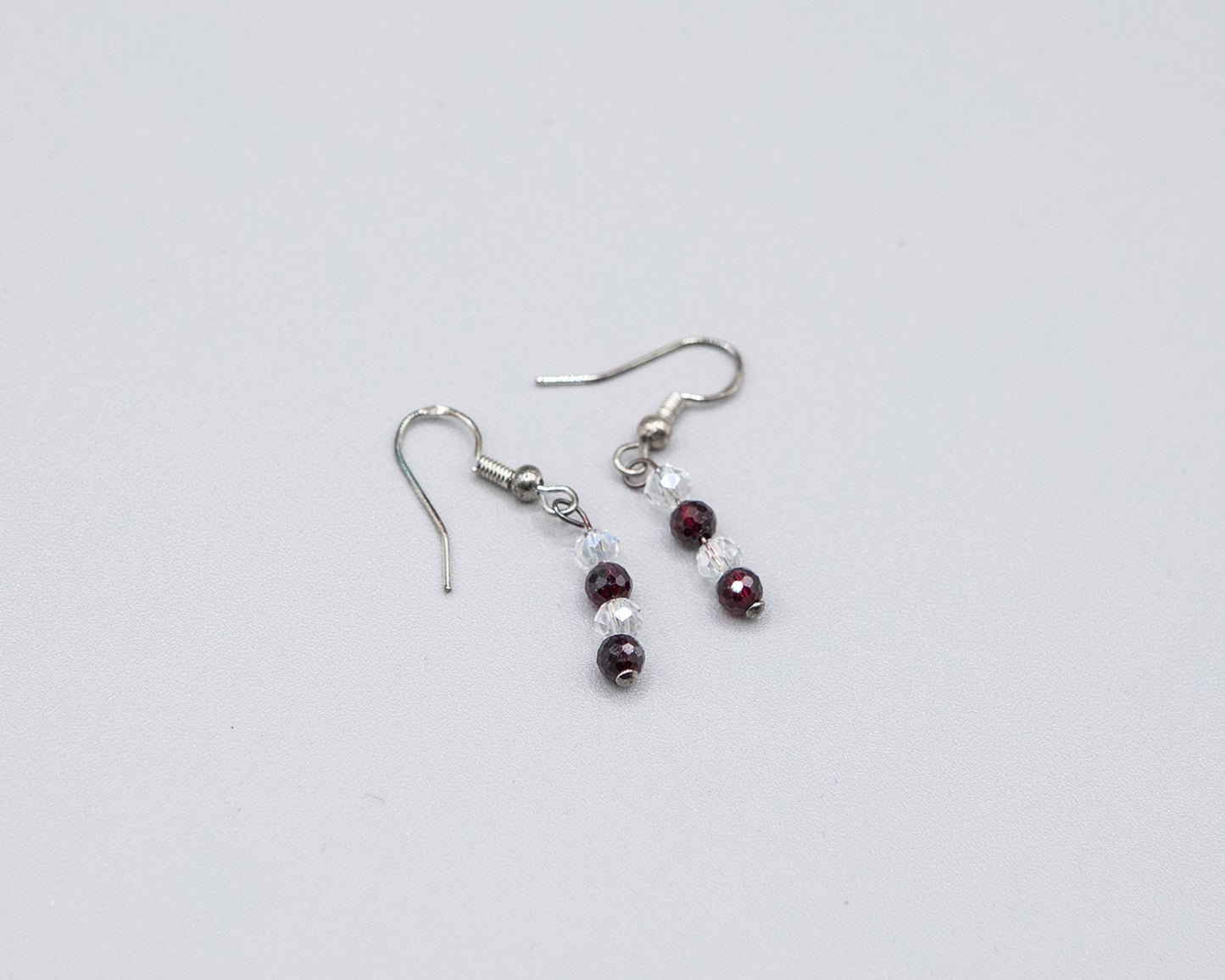 Garnet and clear crystal dangle earrings with sterling silver hooks