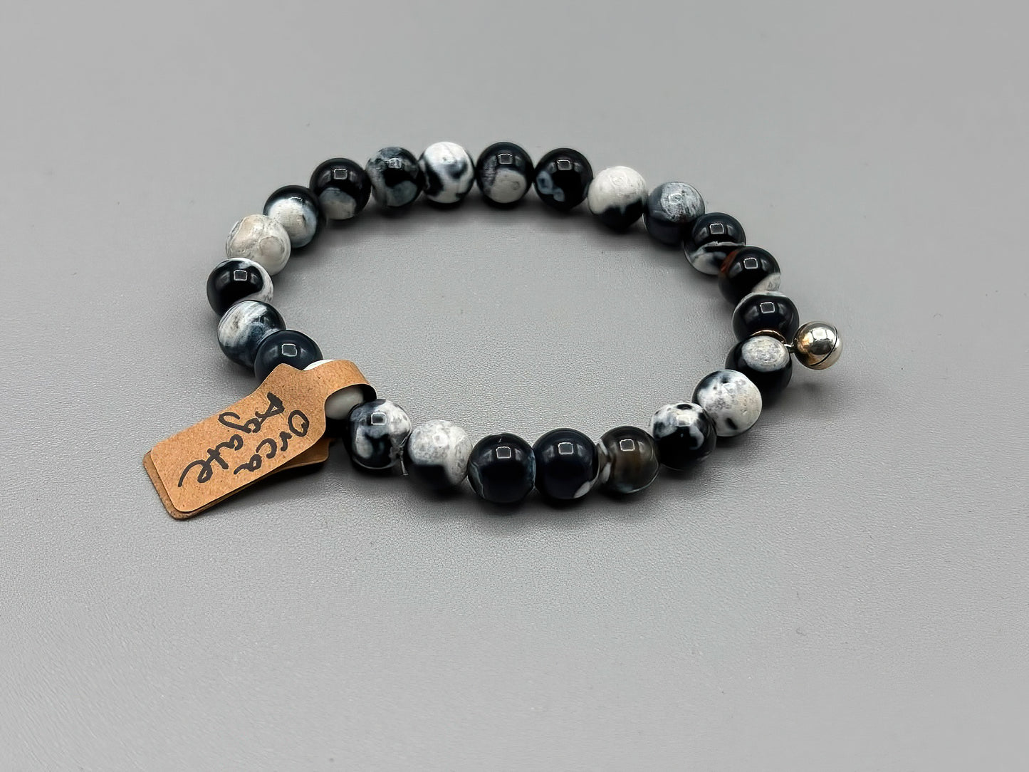 7 inch Black Orca Agate Beaded Bracelet with Sterling Silver chime charm