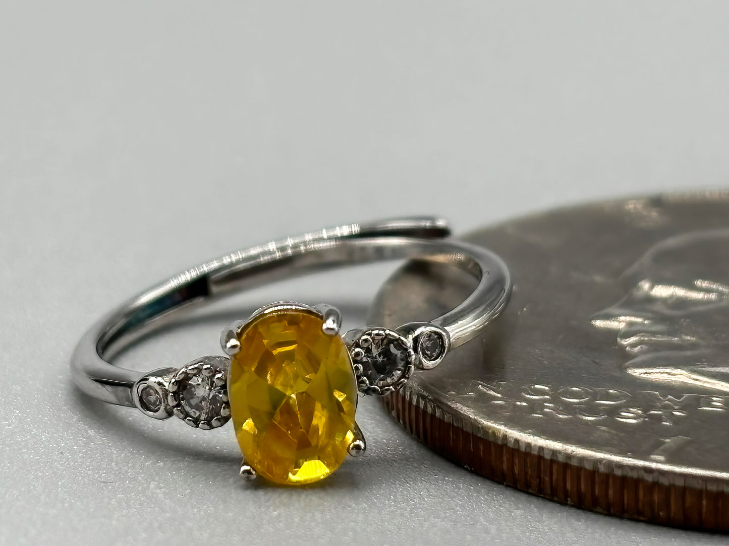 Yellow Cubic Zirconia with white accents, set in adjustable sterling silver band