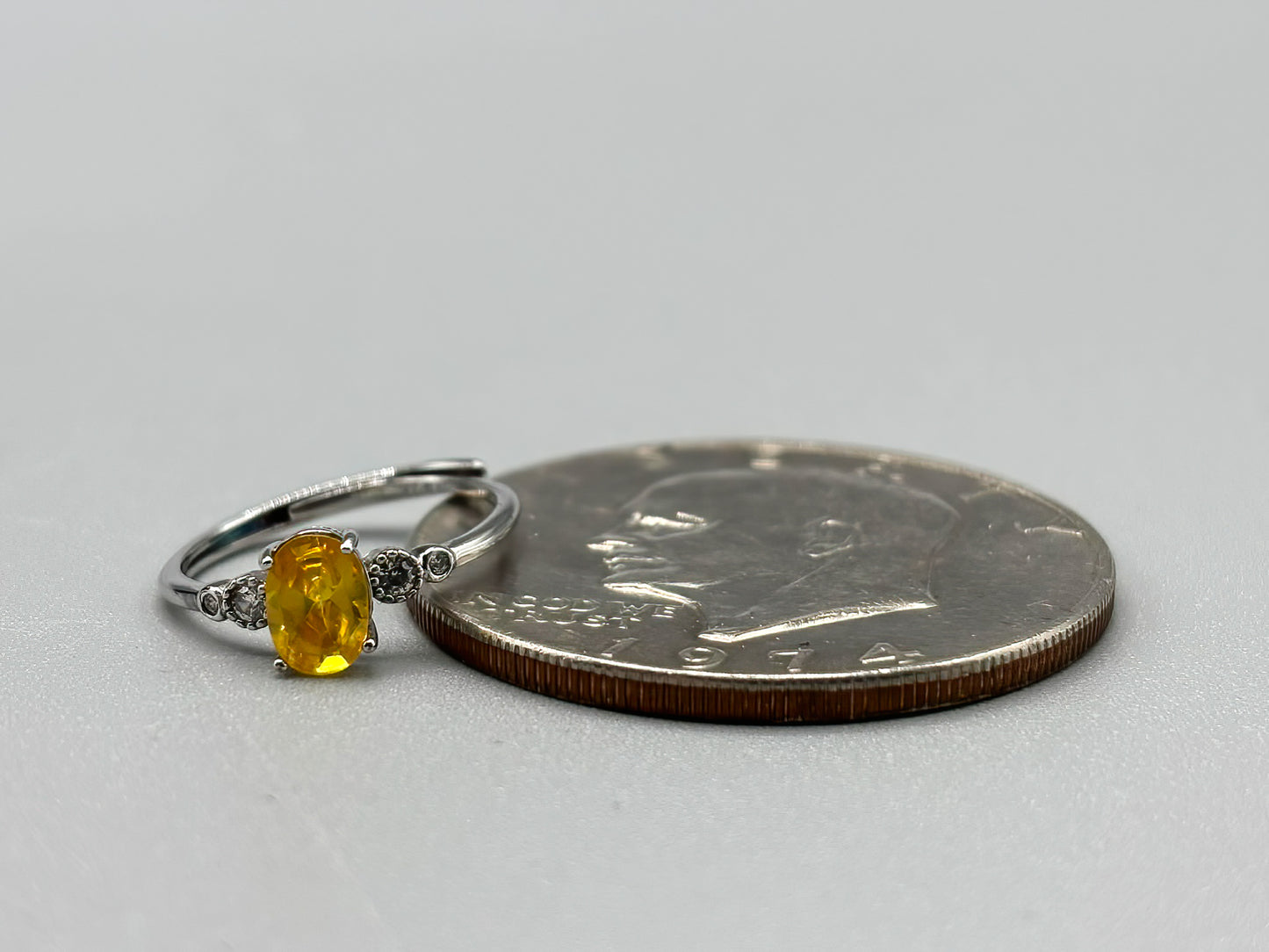 Yellow Cubic Zirconia with white accents, set in adjustable sterling silver band