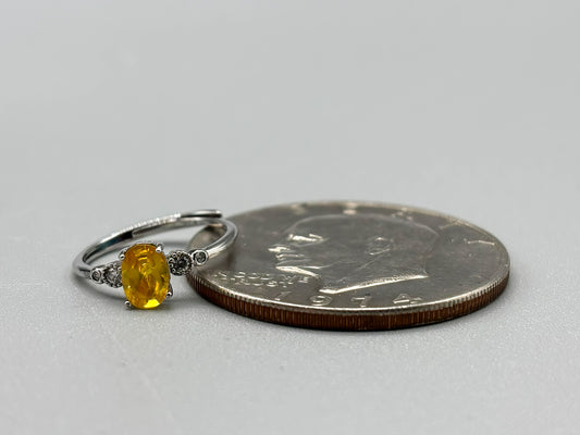 Yellow Cubic Zirconia with white accents, set in adjustable sterling silver band