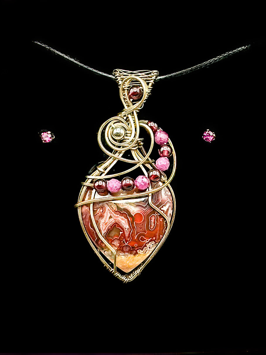 Crazy Lace Heart Adorned with Garnet and Ruby with matching Rhodolite Garnet Earrings in Argentium .940 Silver