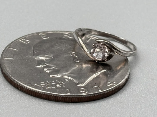 5mm Pink Morganite Facet set in a sterling silver bypass ring setting, Size 7