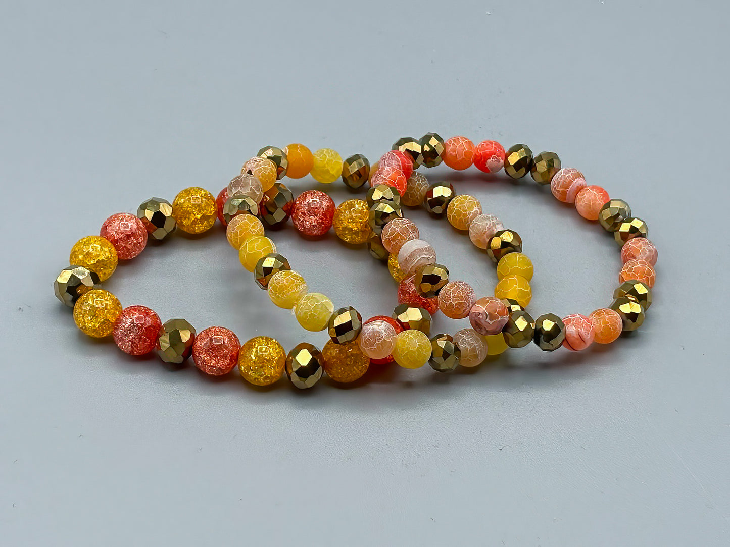 Set of 3 Glass Bead Bracelets in Orange and Gold