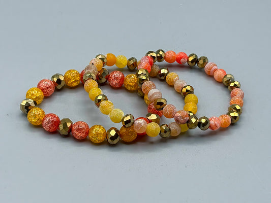 Set of 3 Glass Bead Bracelets in Orange and Gold