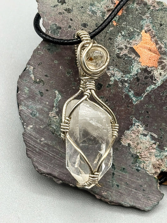 Self Mined Arkansas Quartz Point accented with Firefly Quartz from Brazil, wrapped in sterling silver