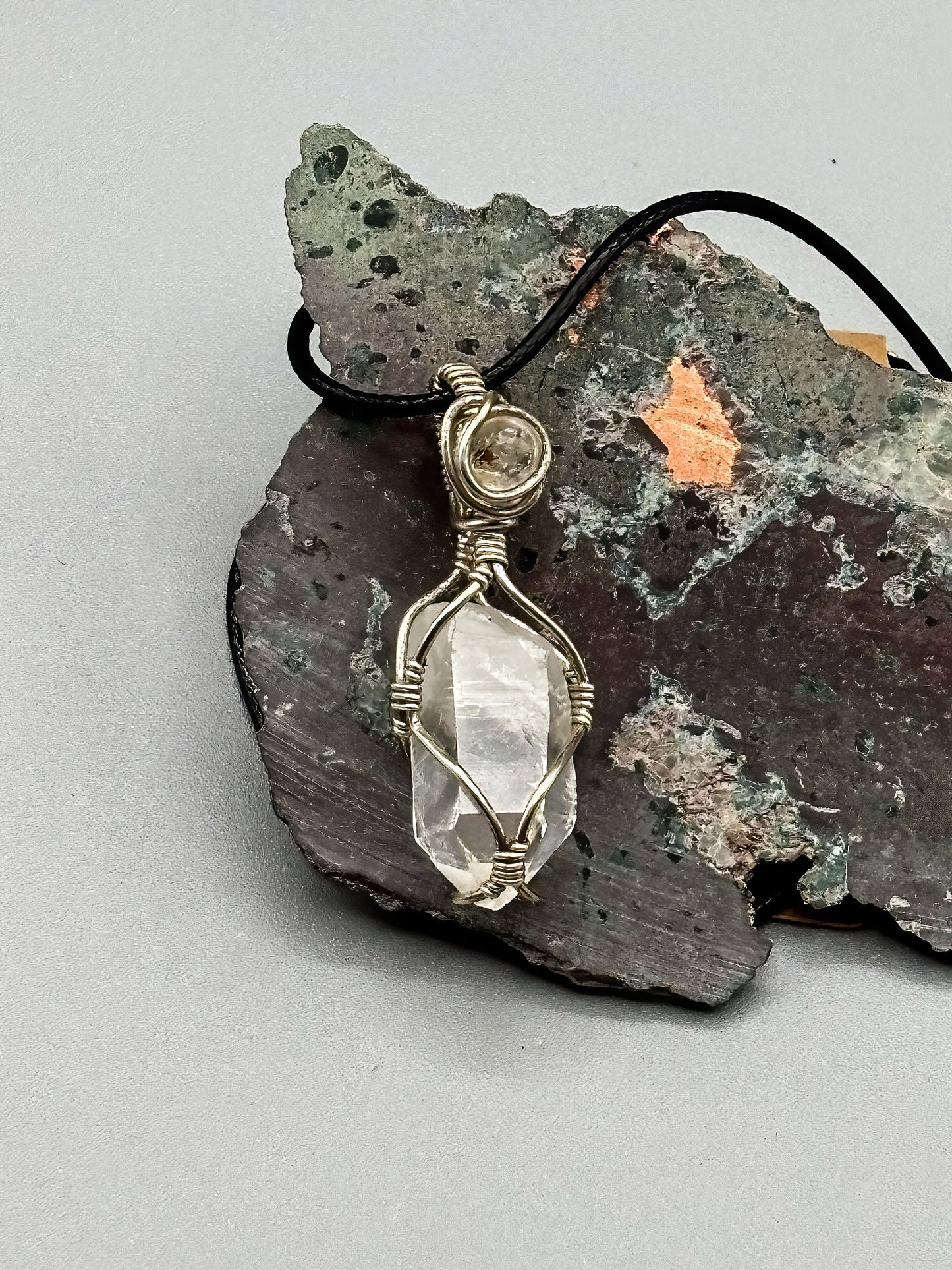Self Mined Arkansas Quartz Point accented with Firefly Quartz from Brazil, wrapped in sterling silver