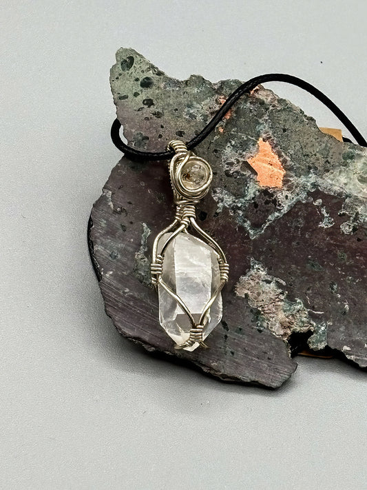 Self Mined Arkansas Quartz Point accented with Firefly Quartz from Brazil, wrapped in sterling silver